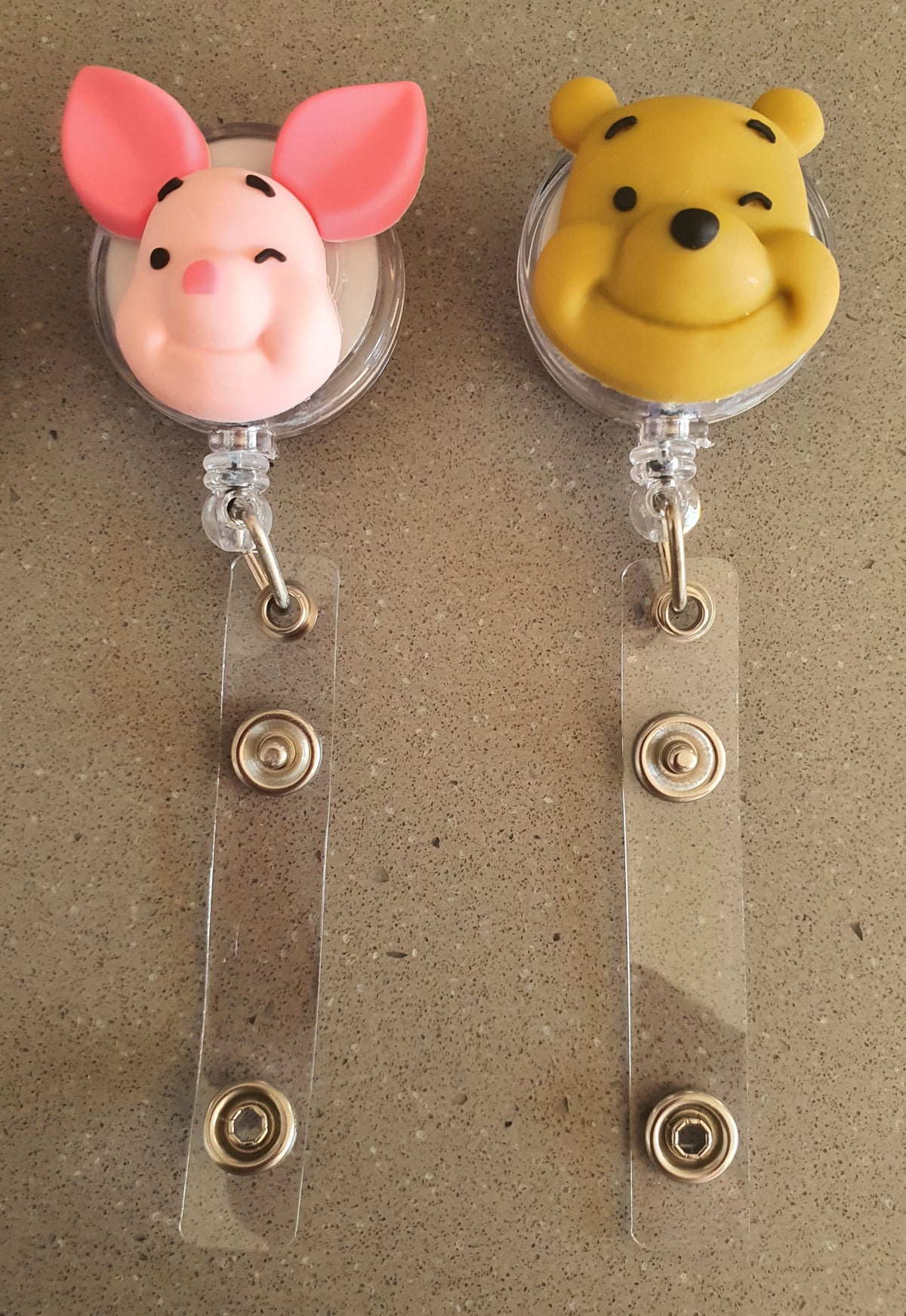 Kids cartoon badge reels with colorful ID card holders featuring PeppaTree Designs characters and retractable reels for easy badge access.