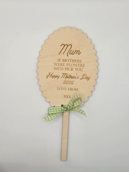 Colorful custom flower and garden keepsake stakes by PeppaTree Designs, featuring five unique decorative designs for outdoor display.