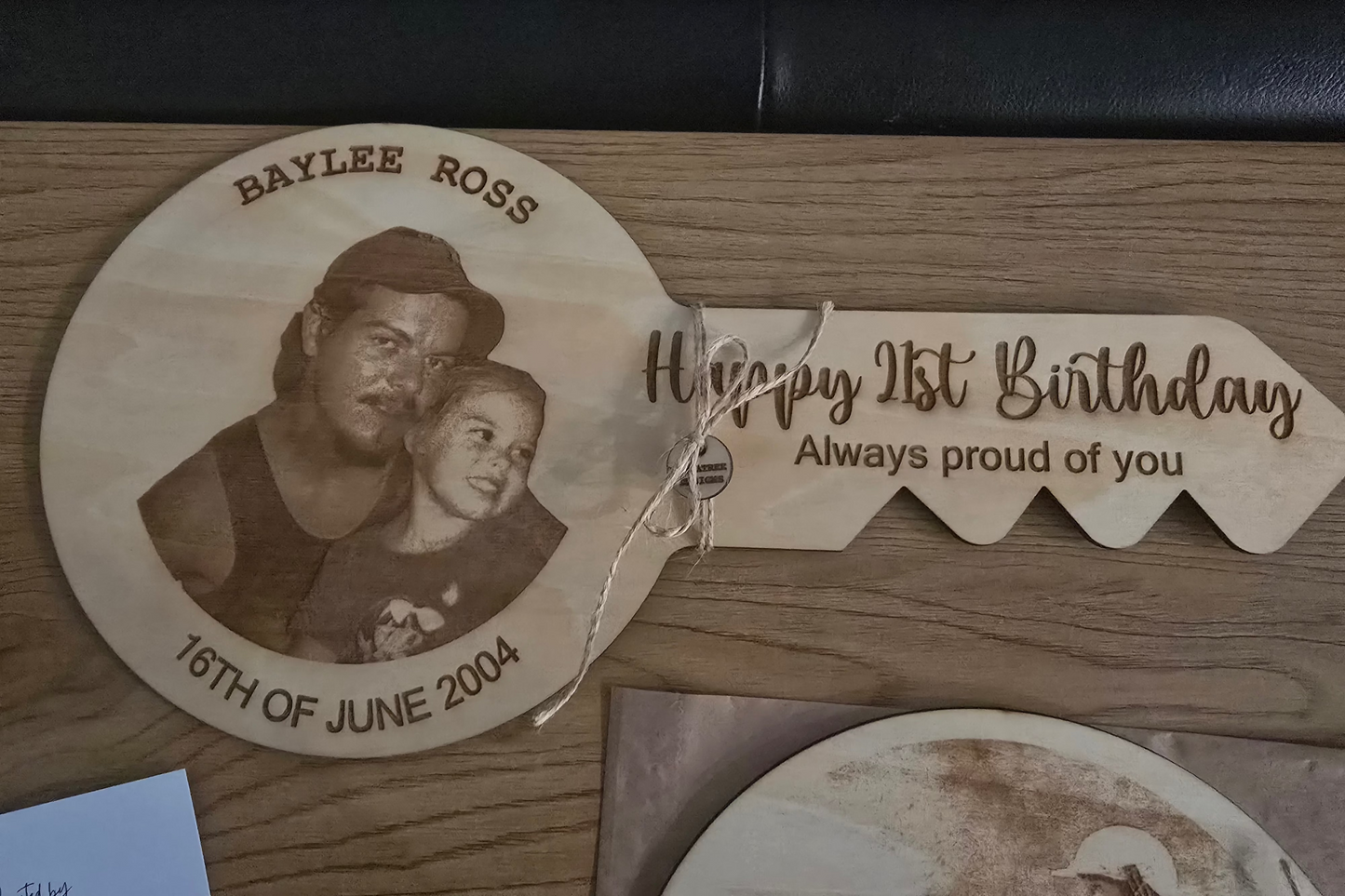 Laser cut wooden 21st keyring with custom engraving from PeppaTree Designs, featuring intricate design details.