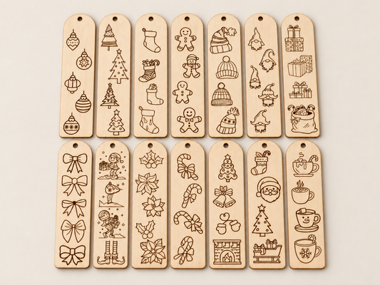 Twelve rectangular wooden tag ornaments with hanging holes, arranged in two rows on a light beige background. Each tag is engraved with different Christmas-themed illustrations including ornaments, trees, stockings, gingerbread men, hats, gifts, bows, leaves, candy canes, Santa, and mugs.