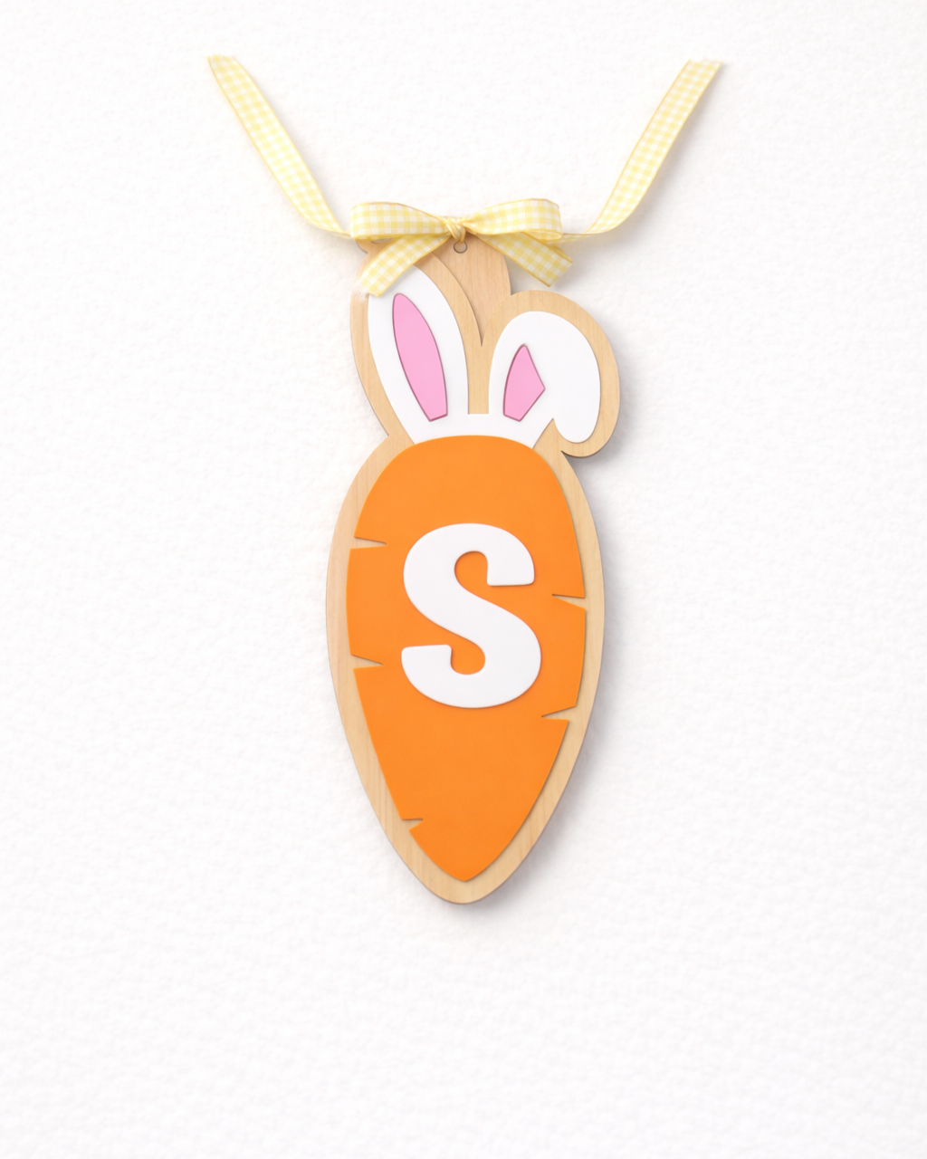Easter basket carrot initial tag by PeppaTree Designs featuring a festive orange carrot design with customizable initial for Easter decor.