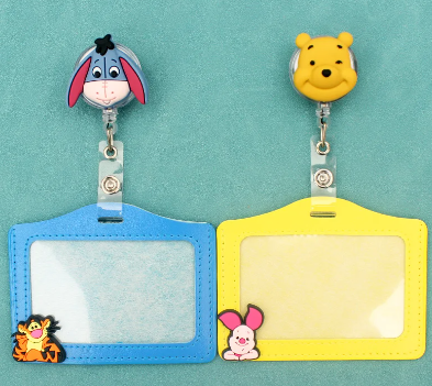 Kids cartoon badge reel featuring a yellow Piglet design from PeppaTree Designs with an ID card holder and retractable reel.