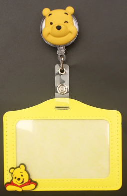 Kids cartoon badge reel featuring Pooh yellow ID holder with PeppaTree Designs, designed for children's ID and badge display.