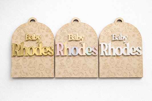 PeppaTree Designs arch baby announcement disc with customizable name on a decorative arch background for newborn celebration.