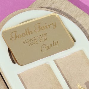 PeppaTree Designs Tooth Fairy Name Sign keychain with colorful, whimsical design featuring a tooth illustration and playful lettering.