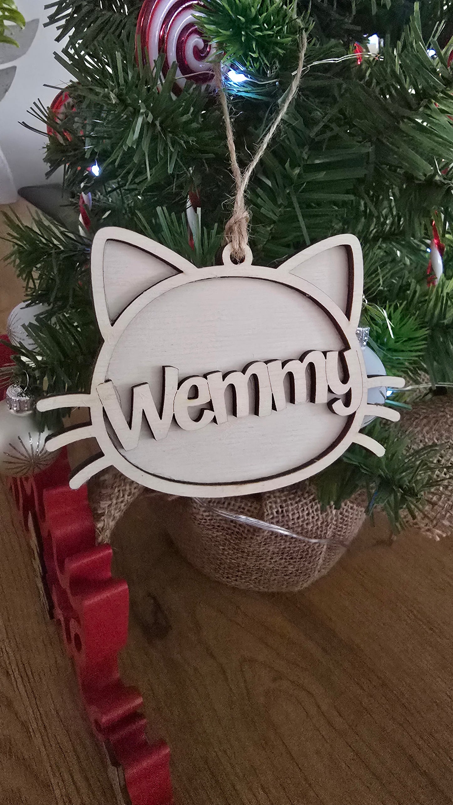 Unfinished wooden cat face ornament for Christmas decoration, personalized holiday decor by PeppaTree Designs.