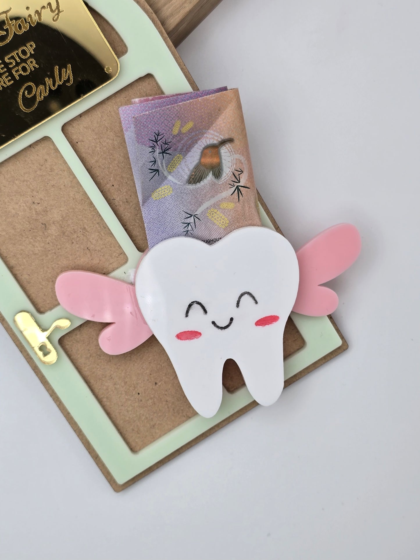 PeppaTree Designs Tooth Fairy Name Sign keychain with personalized engraved name and fairy design on a metal charm.