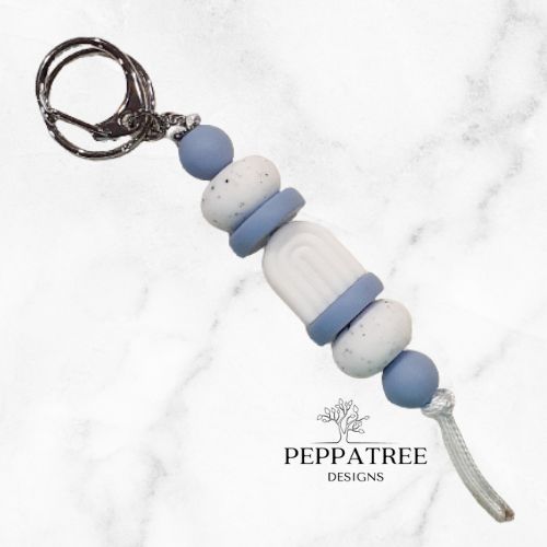 Handmade boho blue storm keychain from PeppaTree Designs featuring arch design, ideal as a keyring or lanyard accessory.