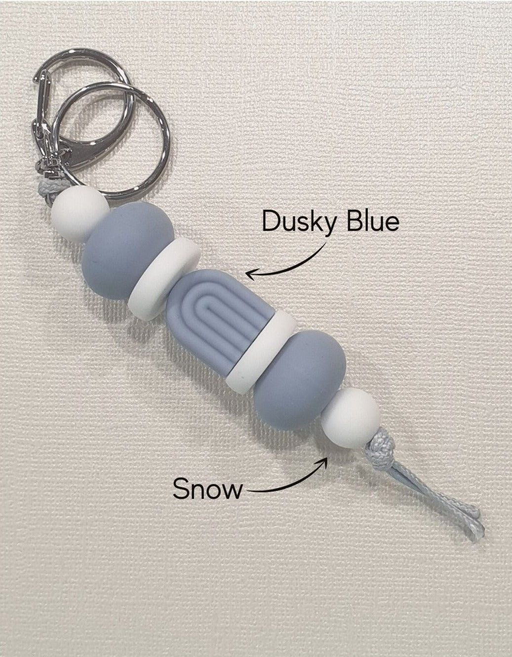 Handmade boho blue storm keyring from PeppaTree Designs, featuring a stylish arch design for keys or lanyards.