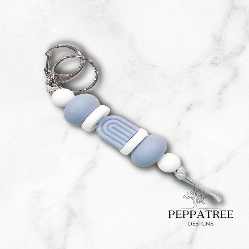 Handmade boho blue storm keyring from PeppaTree Designs, featuring a stylish arch design and durable lanyard holder.