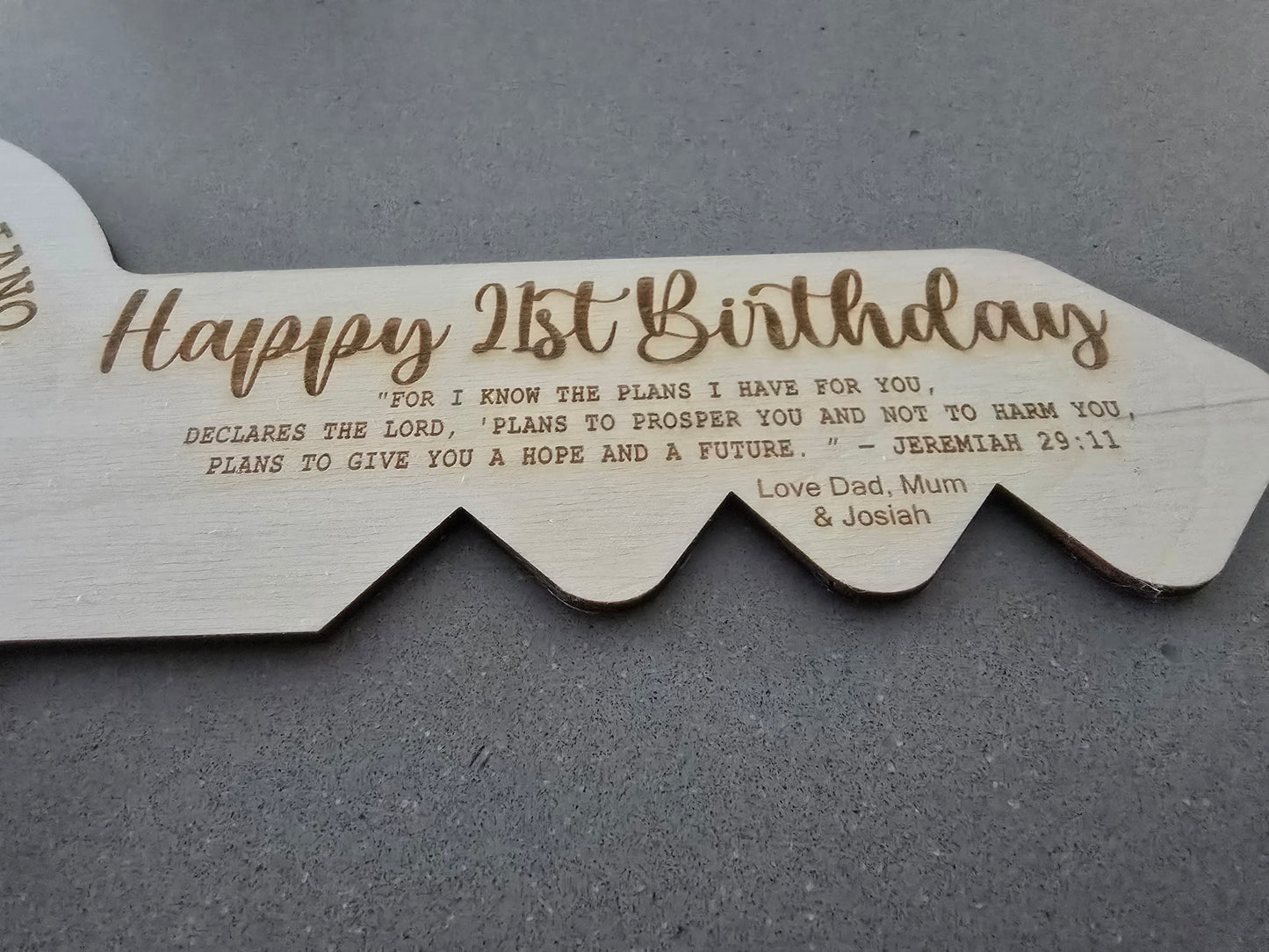 Laser cut custom engraved 21st key by PeppaTree Designs, featuring intricate design details on a metal key.