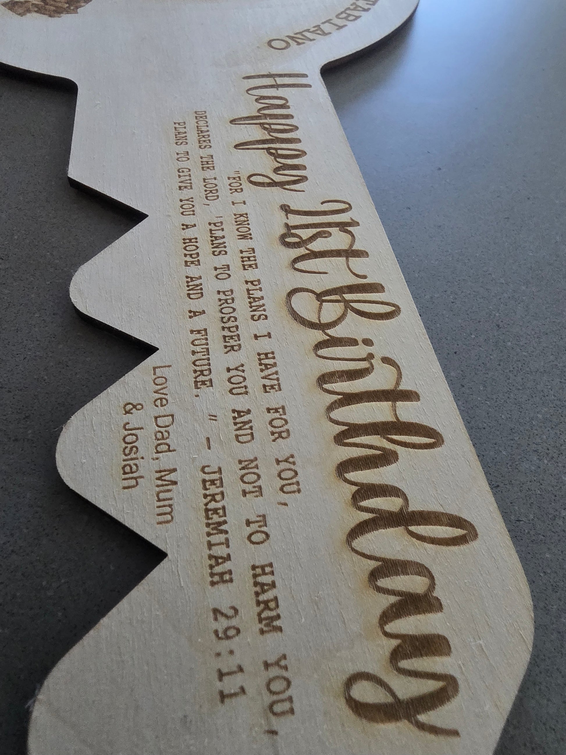 Laser-cut custom engraved 21st key by PeppaTree Designs, featuring intricate design details on the key.