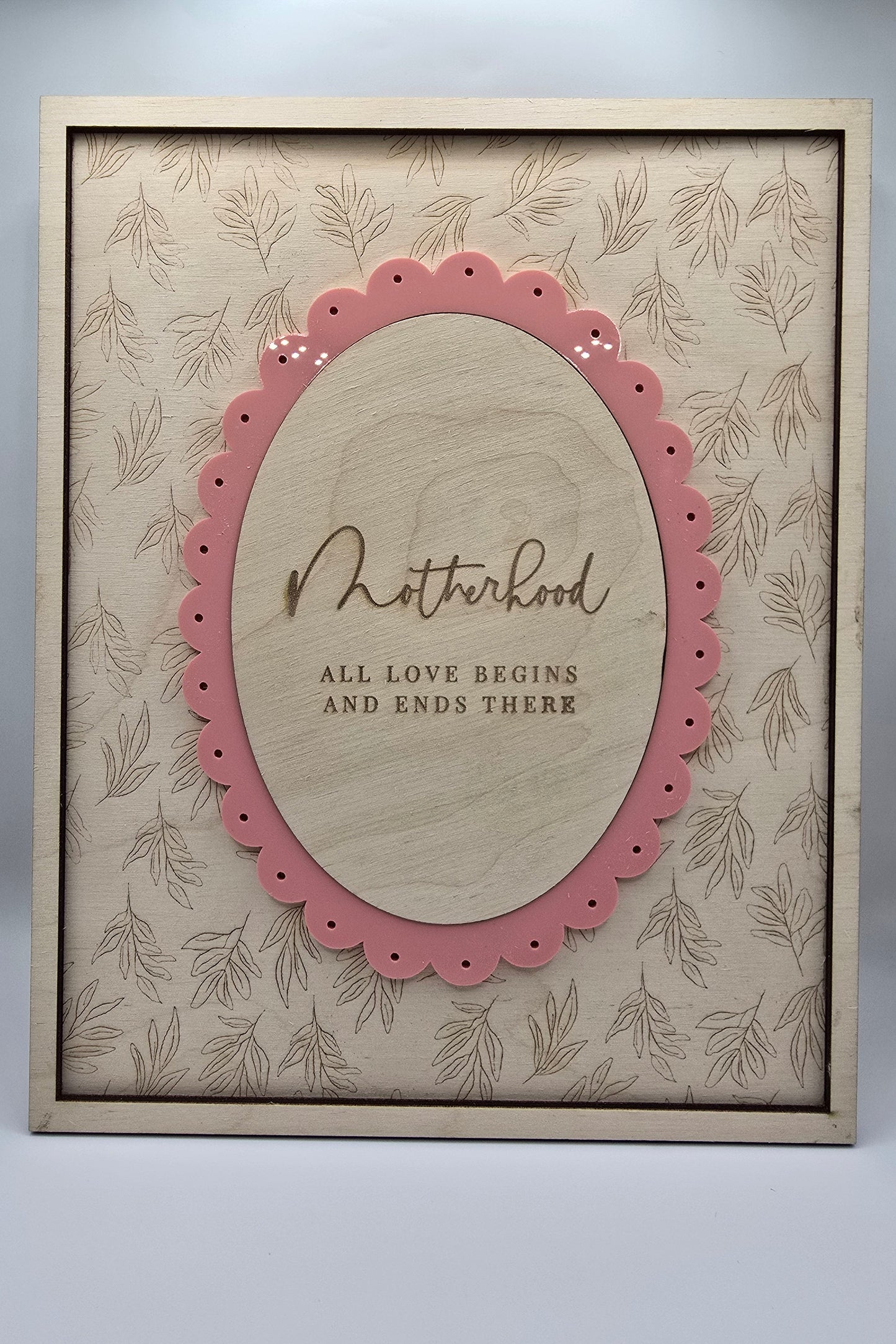 Decorative card with pink border and text on a beige background
