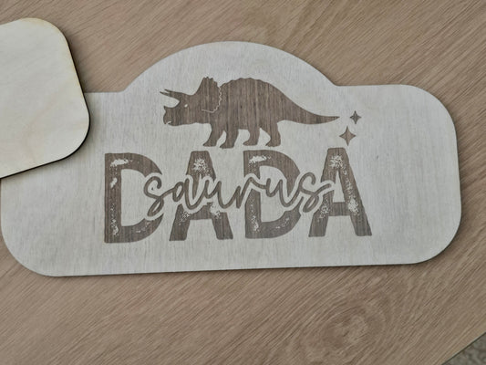 Metal stencil with 'Dalmatia' and a dog silhouette on a wooden surface