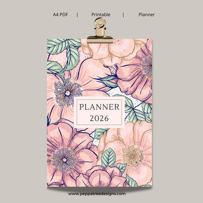 Floral planner cover design for 2026 with a clip on top, on a gray background.