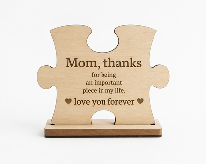 Mom Puzzle Piece wall decor plaque by PeppaTree Designs featuring a heart-shaped puzzle piece with floral accents.