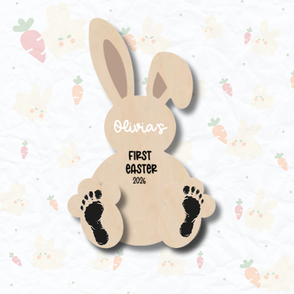 PeppaTree Designs Easter My 1st Easter Bunny Footprint Plaque with colorful bunny and floral accents on a wooden background.