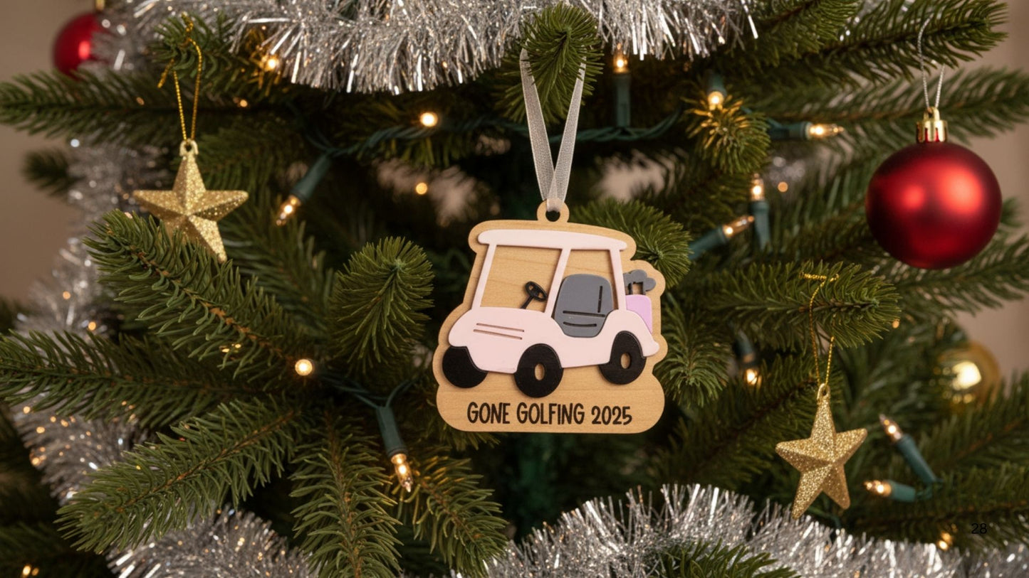Decorative ornament of a golf cart on a Christmas tree with 'Gone Golfing 2025' text.