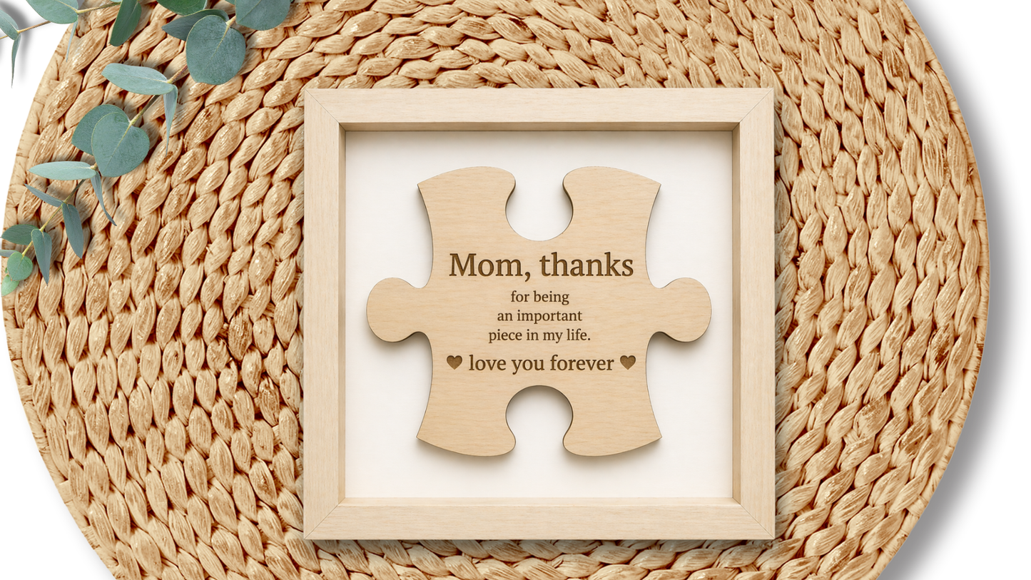 PeppaTree Designs Mom Puzzle Piece wall decor plaque with a heart-shaped design and decorative lettering, suitable for home decor.