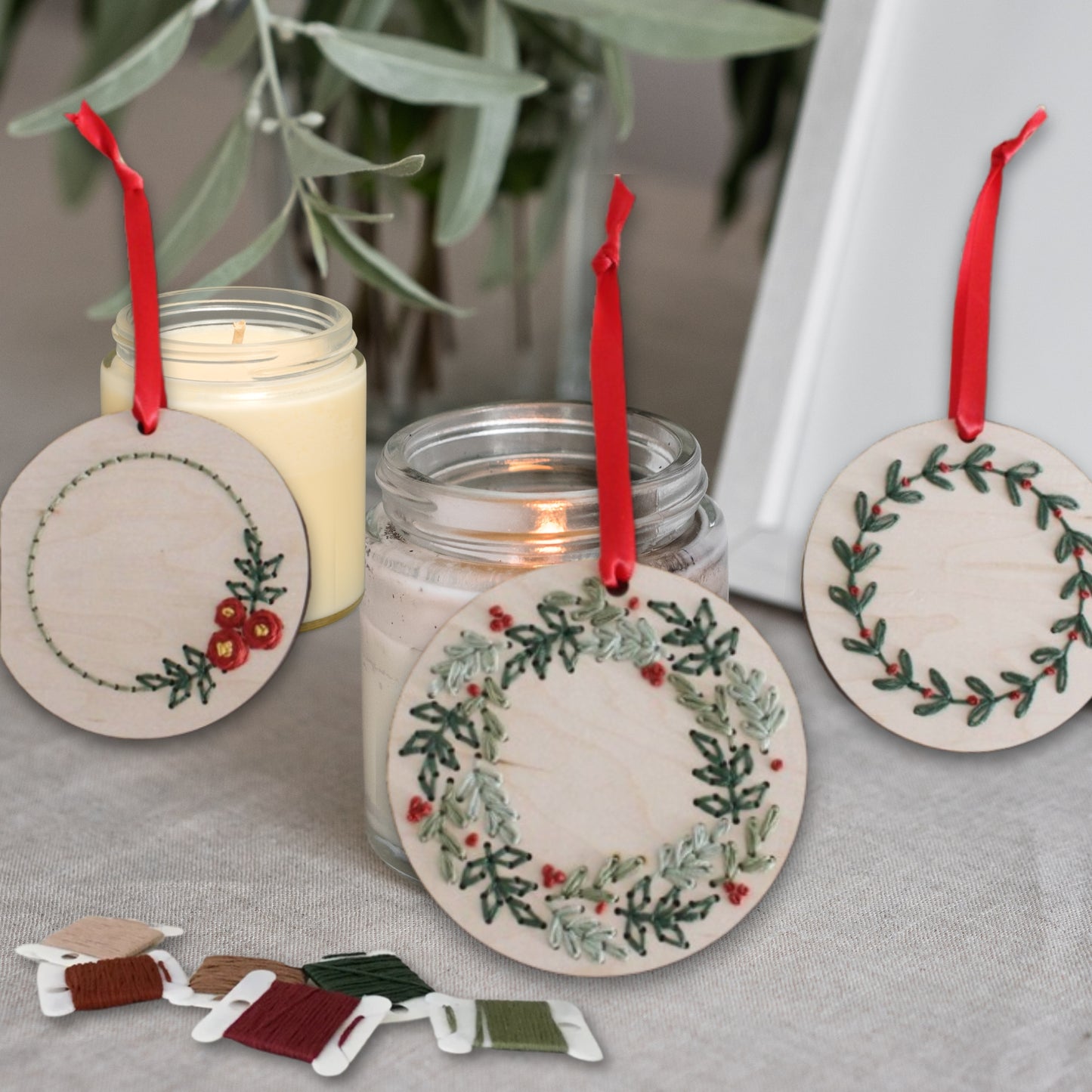Laser cut embroidery Christmas wreath ornaments by PeppaTree Designs, featuring festive holiday designs on a 30x30cm mockup.