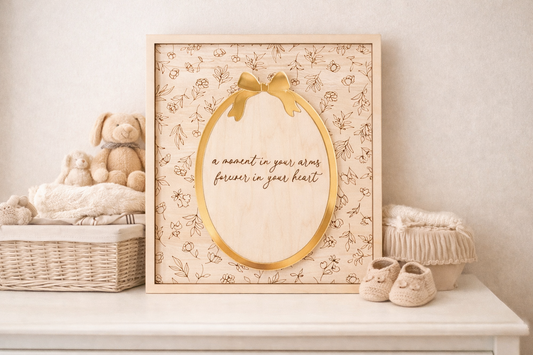 PeppaTree Designs Motherhood Wall Sign Plaque with a decorative bow, ideal for wall decor in a cozy home setting.
