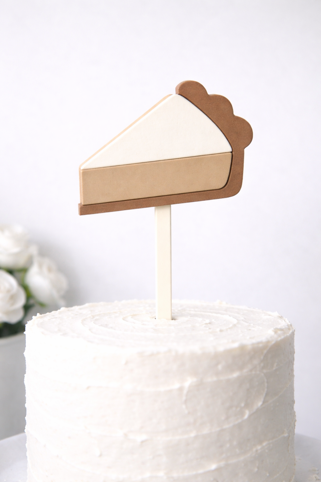 Custom bakery cake topper by PeppaTree Designs featuring colorful decorative elements on a cake piece.