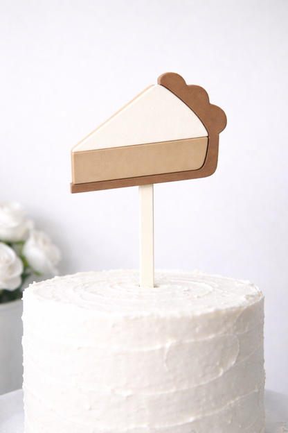 Custom bakery cake topper by PeppaTree Designs featuring colorful decorative elements on a cake piece.