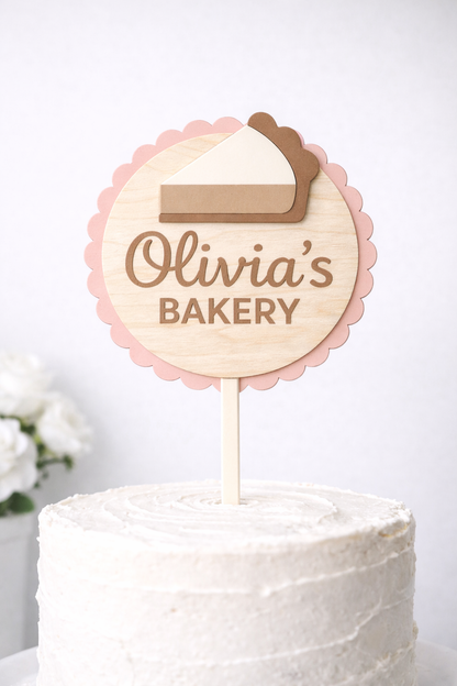 Scalloped round custom bakery cake topper by PeppaTree Designs on a cake piece for celebration.