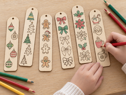 Six wooden Christmas ornament tags with hand-drawn holiday illustrations are arranged on a wooden table, with a child's hands holding colored pencils and coloring one of the tags.