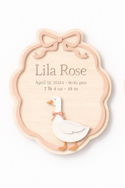 Two baby milestone cards with duck illustrations and 'Lila Rose' text on a white background