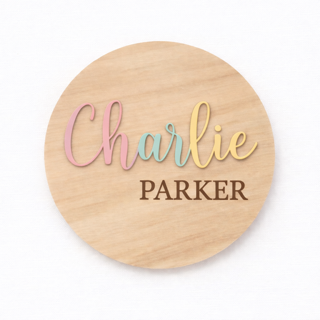 Pastel 3D birth announcement disc from PeppaTree Designs displaying baby's first and last name in soft colors.