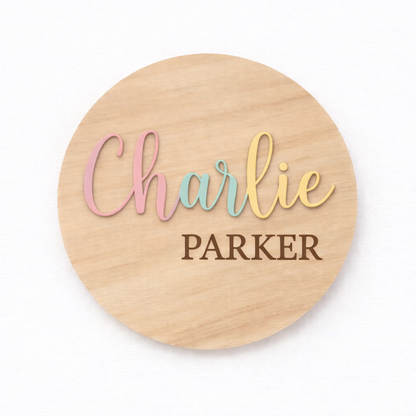 Pastel 3D birth announcement disc from PeppaTree Designs displaying baby's first and last name in soft colors.