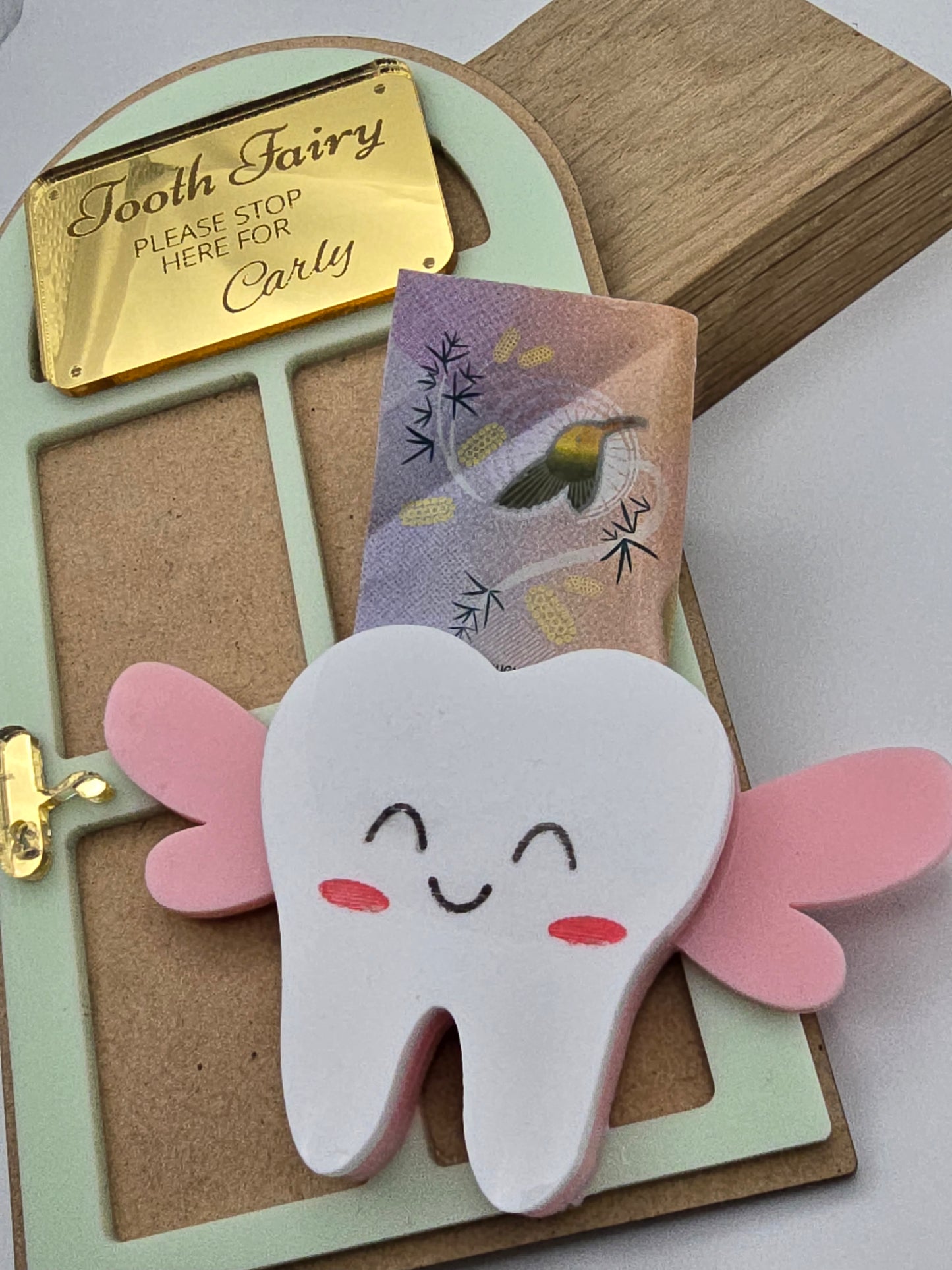 Custom Tooth Fairy Door Name Sign keychain by PeppaTree Designs, featuring a small decorative sign for children's tooth fairy doors.