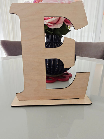PeppaTree Designs initial wood wall sign or shelf sitter with natural wood finish and engraved letter design.