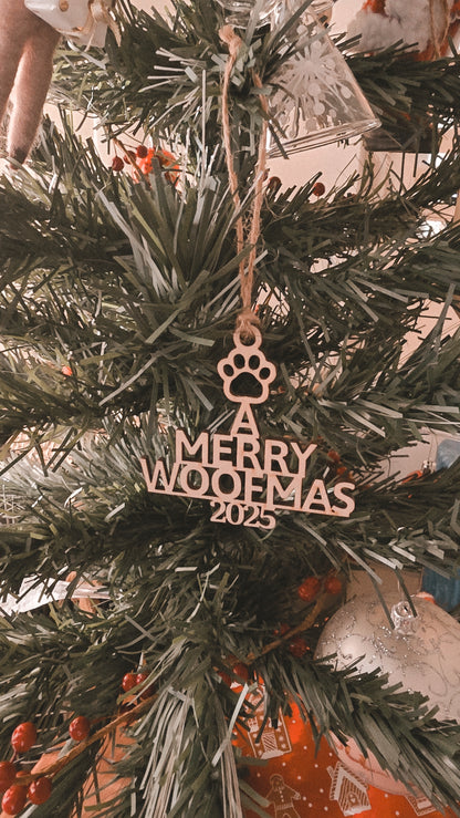 Decorative ornament with 'A Merry Woofmas 2023' on a Christmas tree.