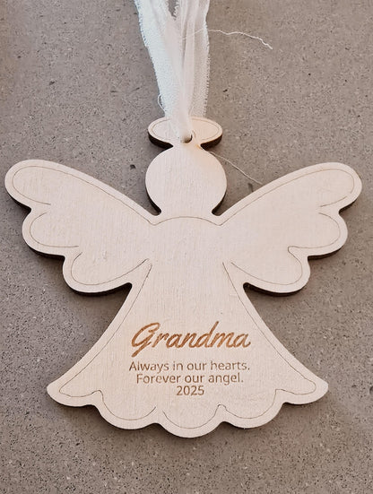 Angel-shaped ornament with 'Grandma' and personalized text on a gray background